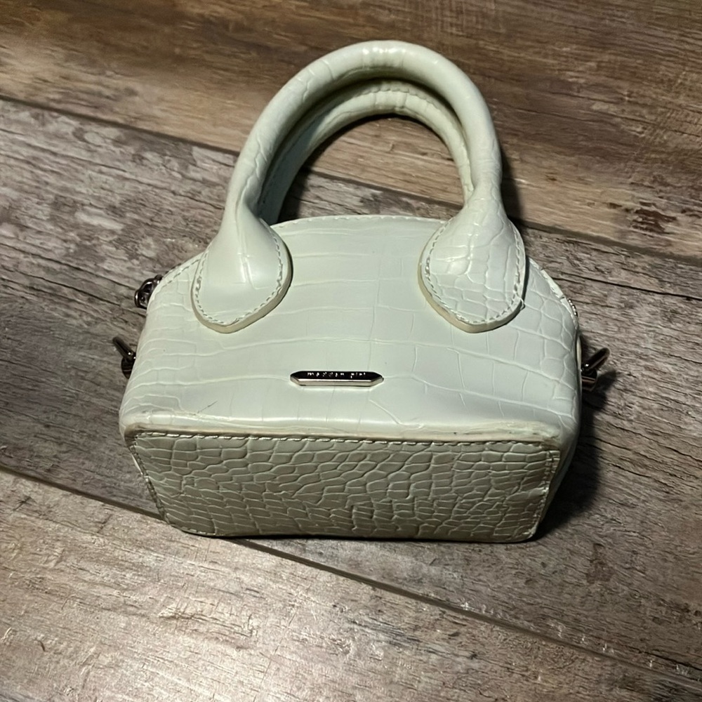 Light green bag brand is madden girl perfect condition